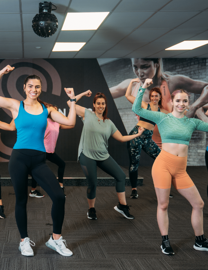 Group of women posing at the gym
